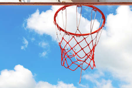 Basketball hoop in the blue skyの写真素材