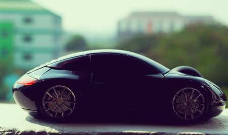 Black car  in retro concept with city sky