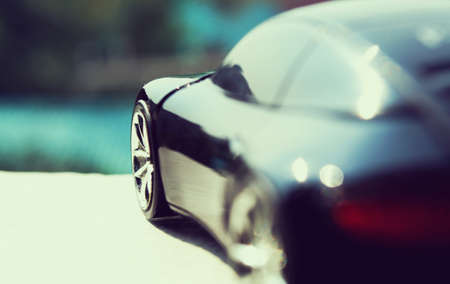 Black car  in retro concept with city skyの写真素材