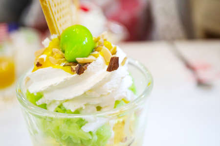 Ice cream and a cherry in the cup.の写真素材