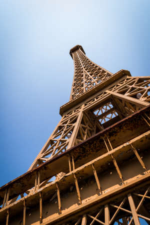 The Eiffel Tower is a landmark by the Republic of France with blue sky.の写真素材