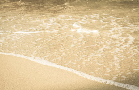 Beach and waves with sand  in the sea .
