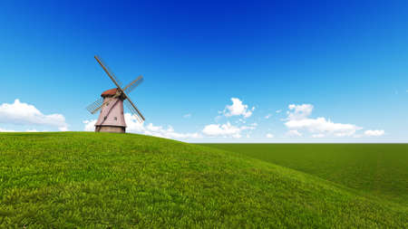 wind turbine in a meadow with blue skyの写真素材