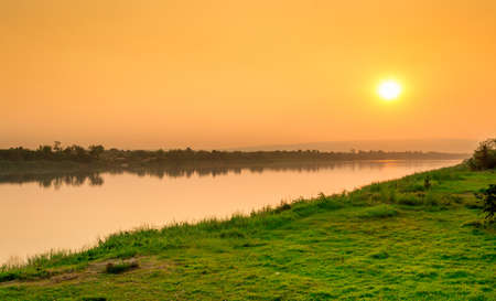 Landscape of the river and mountains at sunset.の写真素材