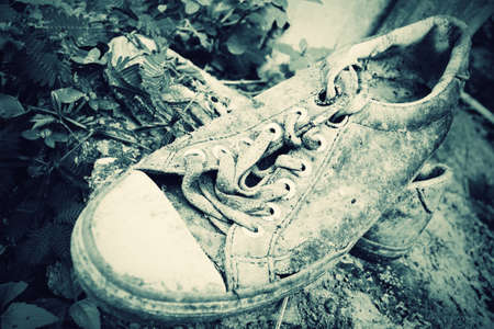 Pair of old sneakers in vintage styleの写真素材