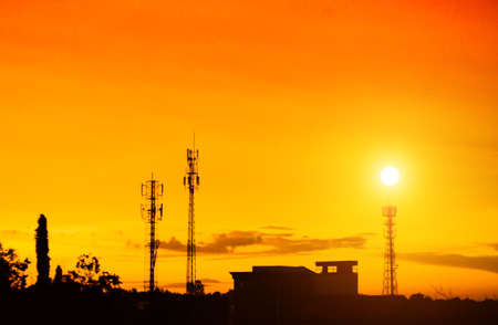 sunset sky and cloud with silhouette antennaの写真素材
