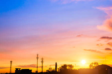 sunset sky and cloud with silhouette antennaの写真素材