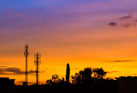 sunset sky and cloud with silhouette antennaの写真素材