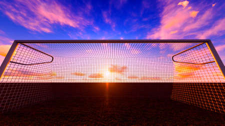 Soccer goal on the football field at sunset.の写真素材