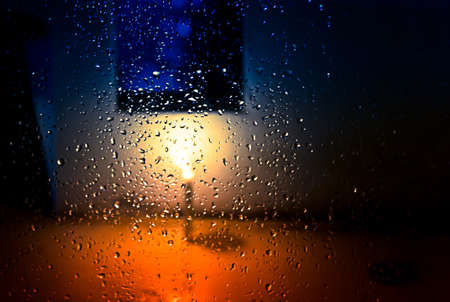 blur and soft focus of water drops with candle lightの写真素材