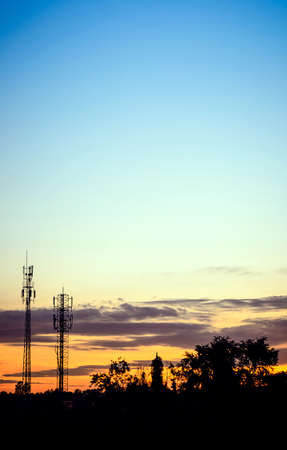sunset sky and cloud with silhouette antennaの写真素材