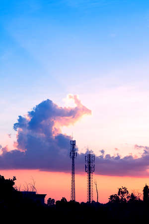 sunset sky and cloud with silhouette antennaの写真素材