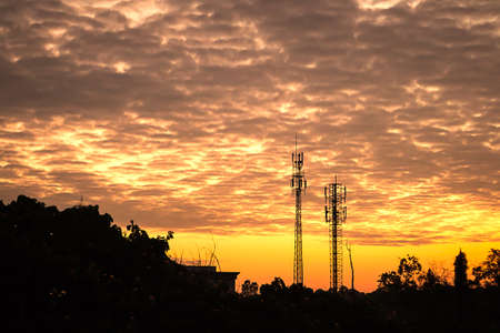 sunset sky and cloud with silhouette antennaの写真素材