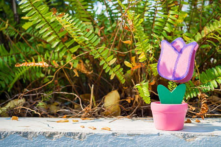 love toy flower on grass in valentine day with vintage color toneの写真素材
