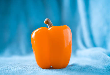 still light photography of yellow sweet pepper on fabric backgroundの写真素材