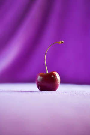 still light photography of cherry on fabric backgroundの写真素材