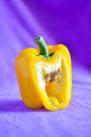 still light photography of yellow sweet pepper on fabric backgroundの写真素材