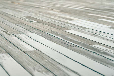 Wet wood floors with vintage color tone for texture and backgroundの写真素材