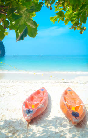 Kayak boat on the beach and seaの写真素材