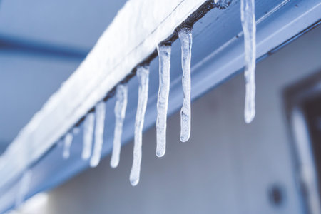 Icicle melt is hanging from a roof