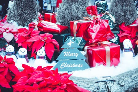 Christmas labels surrounded by gift boxesの写真素材