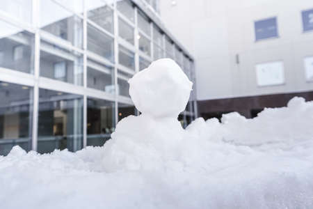 snow on bench chair in winterの写真素材