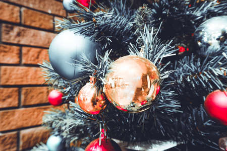 ball and light bulb on christmas treeの写真素材