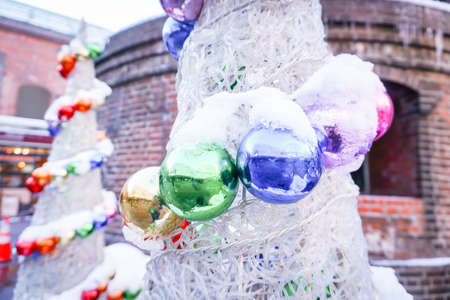 ball and light bulb on christmas treeの写真素材