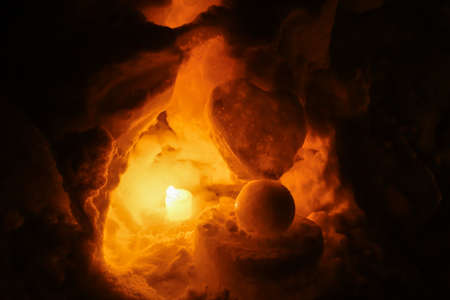 Night time with Candle light in ice and snow on Christmas dayの写真素材