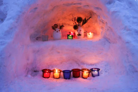 Night time with Candle light in ice and snow on Christmas dayの写真素材