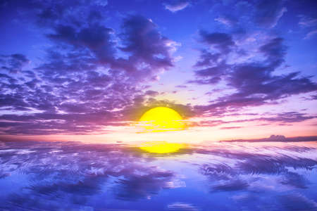 The sun falls in the seaの写真素材