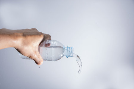 Pour water out of the bottle
