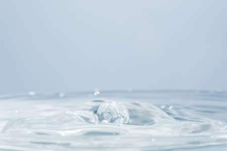 Waves and water dropsの写真素材