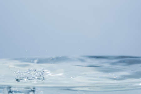 Waves and water dropsの写真素材