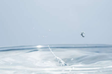 Waves and water dropsの写真素材