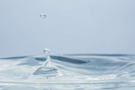 Waves and water dropsの写真素材