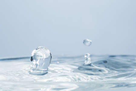 Waves and water dropsの写真素材