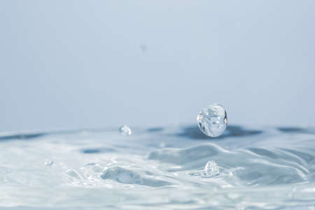 Waves and water dropsの写真素材