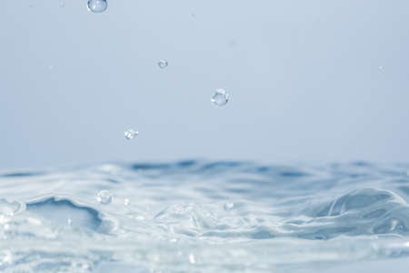 Waves and water dropsの写真素材