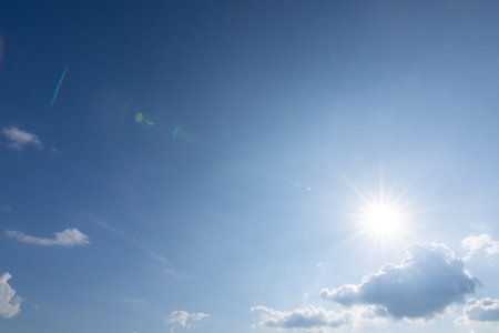 Sun, blue sky and clouds.