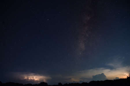 Milkyway and Lightning Sky at nightの写真素材