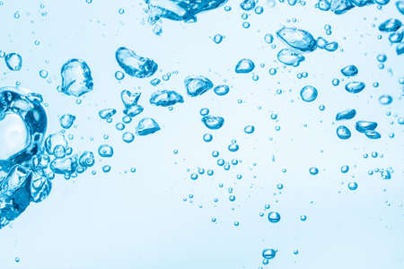 Bubbles in blue water background.の写真素材