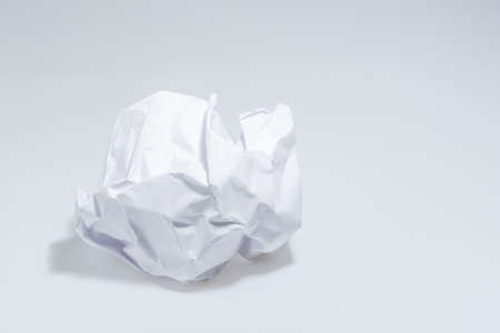 White Paper White crumpled into a ballの写真素材