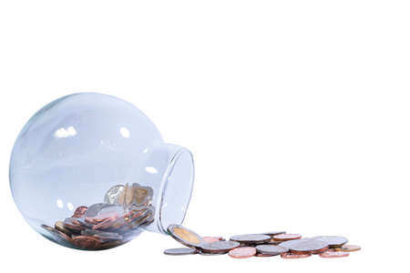 A coin in a bottle isolated on white background Business and finance conceptの写真素材