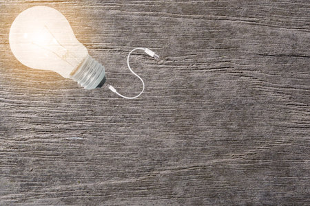 Concept idea light bulb connect wire Illuminated