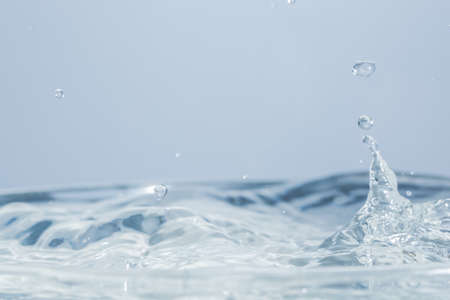 Waves and water dropsの写真素材