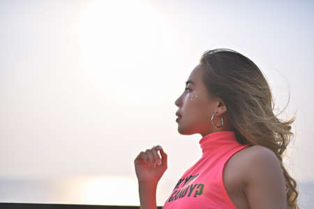 Portrait of a beautiful woman, a pink shirt, a white skirt, a dress on Valentine's Dayの写真素材
