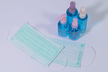 Sanitary mask with alcohol gel to wash hands Prevent coronavirus or covic-19 pathogens. White...