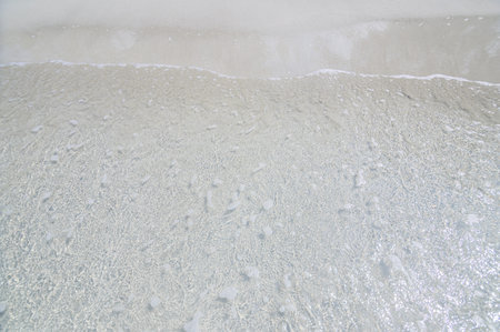 Clear sea waves and sandy beaches during the day time