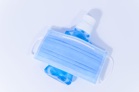 Mask and alcohol gel in the white background